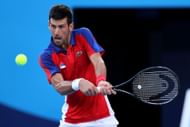 Novak Djokovic plays a backhand at the 2021 Tokyo Olympics